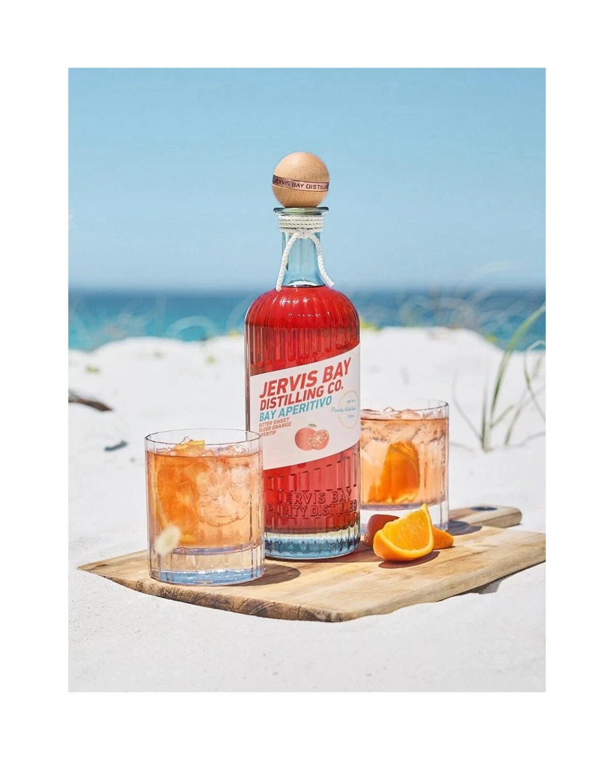 Jervis Bay Distilling Aperitivo craft gin brand at the beach.
